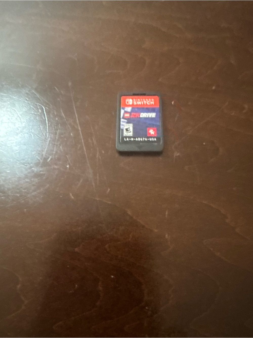 Nintendo Switch game card with red and black label